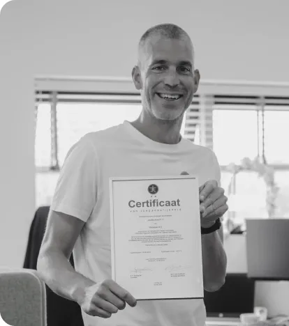 A man standing with a certificate of digital accessibility