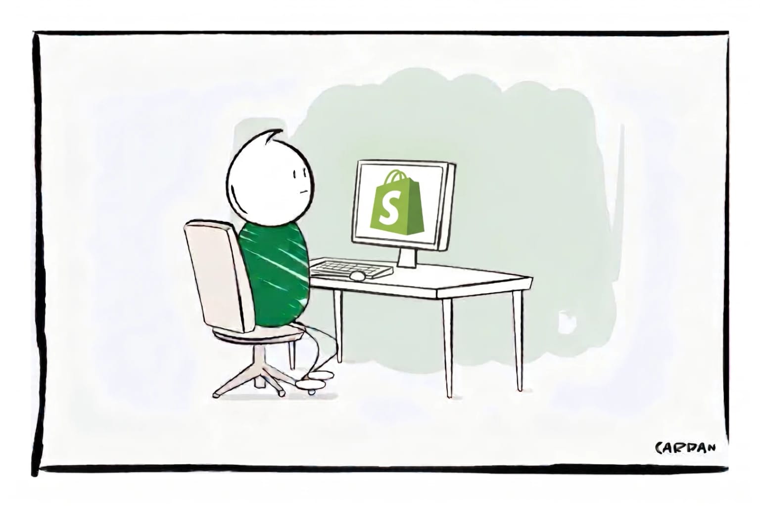 Mannetje kijkt naar desktop scherm met Shopify logo erop